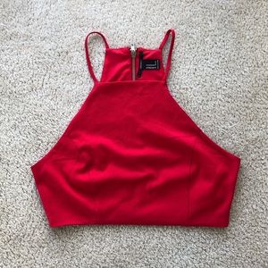 Red crop top with gold zipper detail